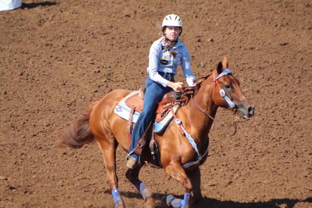 Payton Askins of Shawnee finishes her barrel race.