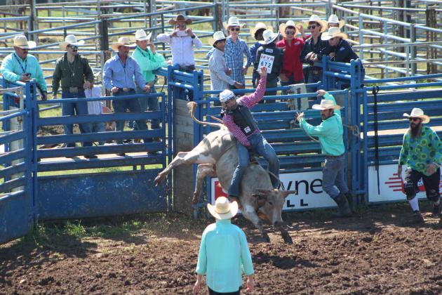 Jeffrey Bixler of Marshall, AR, competes in bull riding on July 10.