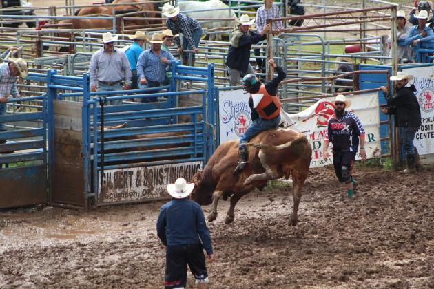 Ryker Butler of McLoud competes in bull riding at the IFYR on July 11.