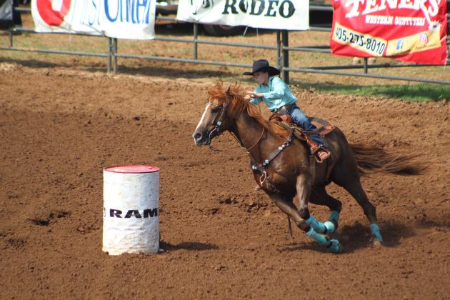 Chazli Massey of Addington, OK, rounds the first barrel in the second round of Barrel Racing at the IFYR on July 13. Countywide &amp; Sun/Natasha Dunagan