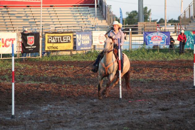 Kaylin McRae of Meeker competes in the pole bending on July 9.