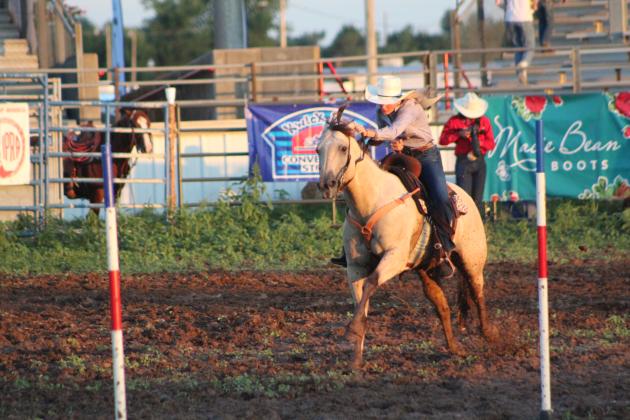 Kaylin McRae of Meeker competes in the pole bending on July 9.