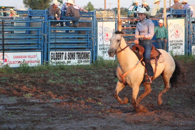 Kaylin McRae of Meeker competes in the pole bending on July 9.