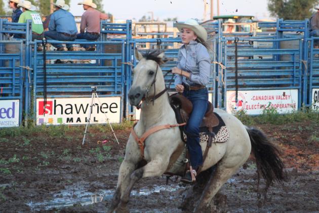 Kaylin McRae of Meeker competes in the pole bending on July 9.