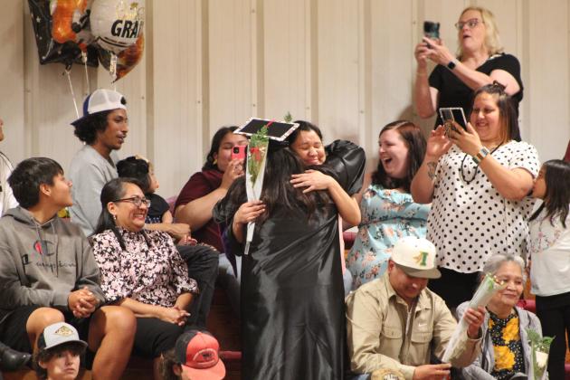 Mariana Siqueiros gives a rose and a hug to her mother, Valerie Tanyan, during the Earlsboro High School Commencement Ceremony on May 11. Countywide &amp; Sun/Natasha Dunagan