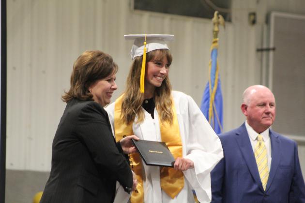Maud High School Salutatorian Aubrey Williams receives her diploma from Superintendent Cindy White.