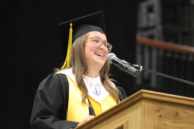 Tecumseh High School Senior Class President and Co-Salutatorian Ella Whitney has a laugh while speaking to her classmates during the THS Commencement Ceremony on May 17 at FireLake Arena. Countywide &amp; Sun/Natasha Dunagan