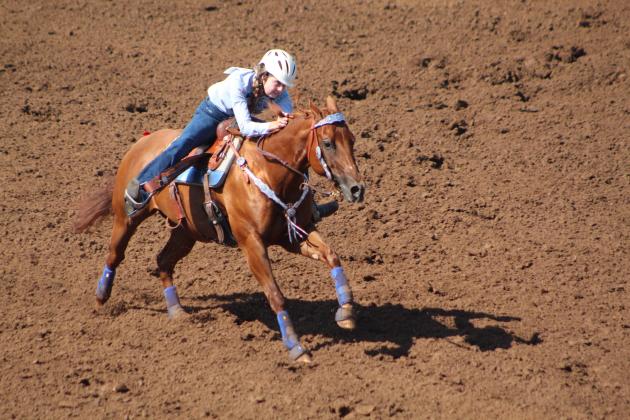 Payton Askins of Shawnee finishes her barrel race at the International Finals Youth Rodeo on the morning of July 10.