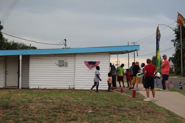 A line forms and kids play at Epic Sno Cones on July 3.