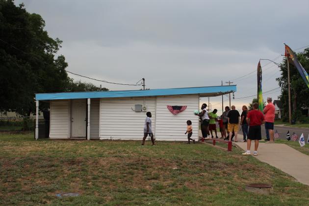 A line forms and kids play at Epic Sno Cones on July 3.