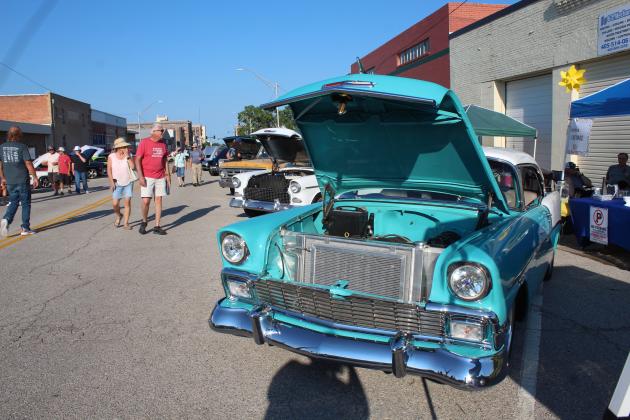 Shawnee Mayor Ed Bolt and his wife Phyllis enjoy the Downtown at Sundown Car Show, which included this 1956 Chevrolet 210 Sport Coupe, owned by Ernest Petty of Shawnee. This was the fourth annual car show presented by Downtown Auto Body and DTAB Customs, and there were about 300 cars entered, said Tommy Hibben with the business.