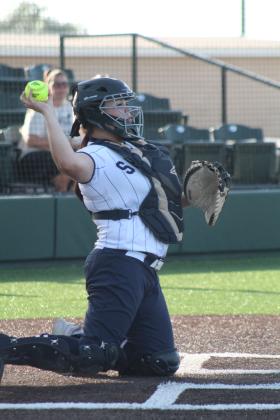Shawnee senior Adesyn Waite throws back to the pitcher.