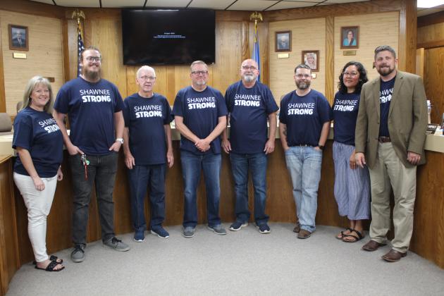 The Shawnee Board of Education poses with new Superintendent Dr. Aaron Espolt, far right, in their "Shawnee Strong" shirts, in support of Shawnee's tornado recovery efforts, on Aug. 7. Shown, from left, are Board Clerk April Stobbe, Second Vice President Turner Bass, Bobby Canty, Russ Oliver, First Vice President Keith Sandlin, President Clif Harden, Kristen Wilson and Espolt. Countywide &amp; Sun/Natasha Dunagan