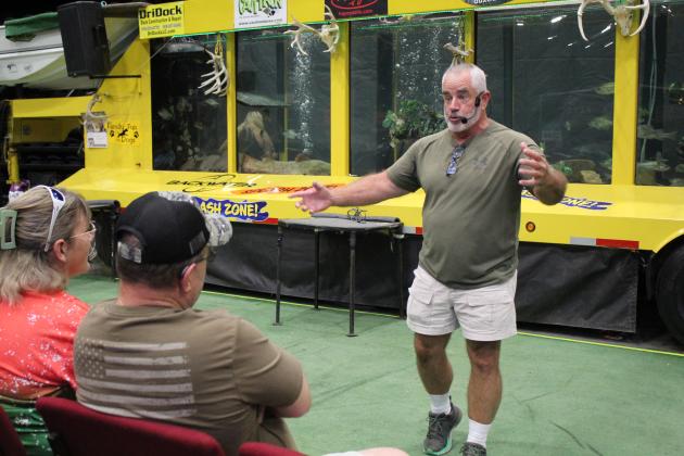 Greg Koch talks about the best times to deer hunt - and about a big hug he received after his advice yielded results - during the Outdoor Nation Expo on Aug. 11 at FireLake Arena. Countywide &amp; Sun/Natasha Dunagan