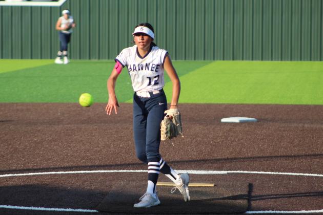 Shawnee freshman Alivia Grass hurls it over home plate.