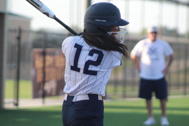 Shawnee freshman Alivia Grass hits a single during the McAlester game in the Shawnee Softball Tournament, held at FireLake Ball Fields on Aug. 24. The Lady Wolves lost 6-25. Countywide &amp; Sun/Natasha Dunagan