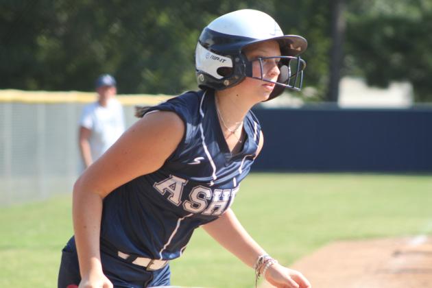 Asher senior Magi Melton runs after hitting a single.
