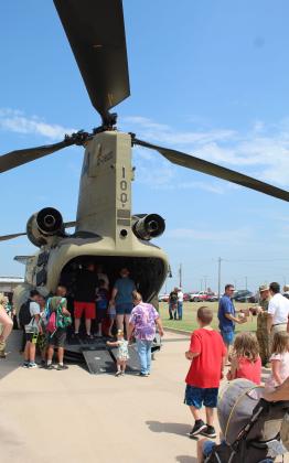 People of all ages enjoyed touring the Chinook Cargo Helicopter (CH47) F Model during Cops N’ Kids at the Heart of Oklahoma Expo Center on Aug. 26. Flown by U.S. Army Chief Warrant Officer 5 Mike McGill with the help of Flight Engineer First Sgt. Robert Calvert, the helicopter traveled from Lexington, OK, and tried to get to the event early so it wouldn’t cause havoc. The CH47 was the Cops N’ Kids Mystery Display this year. Countywide &amp; Sun/Natasha Dunagan