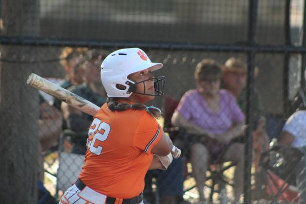 Maud's Amerikus Street sees her ball sail after hitting a double in the first inning of the home game with Vanoss, Aug. 28. The Lady Tigers lost, 11-12, making their record 9-7. Countywide &amp; Sun/Natasha Dunagan