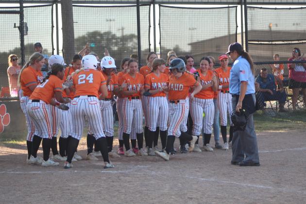 The Maud Lady Tigers applaud Makalee Harrell after her home run in the Vanoss game, Aug. 28. Countywide &amp; Sun/Natasha Dunagan