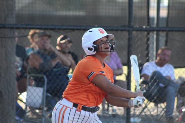 Maud's Amerikus Street sees her ball sail after hitting a double in the second inning of the home game with Vanoss, Aug. 28. The Lady Tigers lost, 11-12, making their record 9-7. Countywide &amp; Sun/Natasha Dunagan