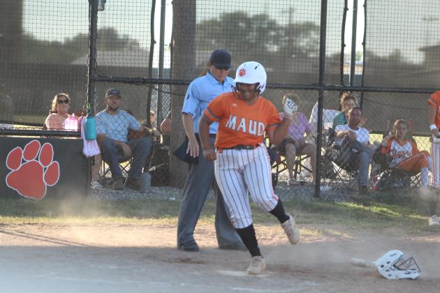 Maud’s Amerikus Street dodges the Vanoss catcher and makes it to home base in the second inning of the game against Vanoss.