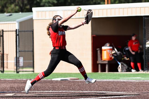 North Rock Creek senior. Hailey Hacker, starting pitcher for the Cougars, winds up for the pitch. Photo courtesy of Gowin Photography