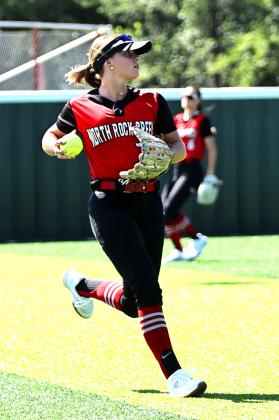 North Rock Creek senior Olivia VanAntwerp makes the catch in left field. Photo courtesy of Gowin Photography