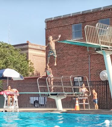 A young boy jumps from the high diving board at the Shawnee Splash Water Park on July 29. Countywide &amp; Sun/Natasha Dunagan