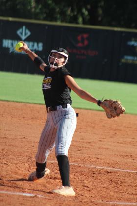 Tecumseh senior Serenity Jacoway prepares to send the ball screaming past home plate during the third inning of the home game with Cleveland on Aug. 14. The THS fast pitch team won, 17-0. Countywide &amp; Sun/Natasha Dunagan