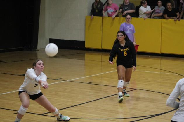 Tecumseh's Katie Johnson returns the ball, as Libero Kayloni Cruz looks on, during the Lady Savages' third game with Blanchard on Aug. 24. Tecumseh lost, 0-3. Countywide &amp; Sun/Natasha Dunagan