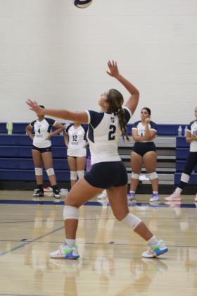 Shawnee's Kalieo Citizen locks her gaze on the ball as she serves in their third game against Duncan on Aug. 24. The varsity volleyball team is playing at the Shawnee Middle School gym this year due to tornado damage at the Performing Arts and Athletic Center. They lost, 0-3. Countywide &amp; Sun/Natasha Dunagan