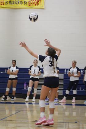 Shawnee's Jordan Tash jumps up to serve in their third game against Duncan on Aug. 24. The varsity volleyball team is playing at the Shawnee Middle School gym this year due to tornado damage at the Performing Arts and Athletic Center. They lost, 0-3. Countywide &amp; Sun/Natasha Dunagan