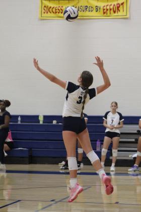 Shawnee's Jordan Tash jumps up to serve in their third game against Duncan on Aug. 24. The varsity volleyball team is playing at the Shawnee Middle School gym this year due to tornado damage at the Performing Arts and Athletic Center. They lost, 0-3. Countywide &amp; Sun/Natasha Dunagan
