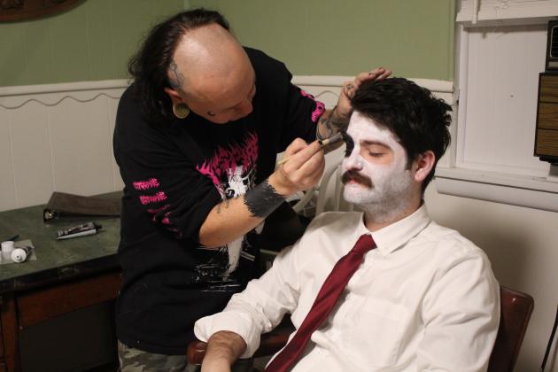 Makeup Artist Macgyver McRobie blacks out around Dylan Black's eyes on Sept. 8. Broadway Chapel in Tecumseh was the location for the Dead End Film House silent short film, "Seance," and Black played a ghoul. Countywide &amp; Sun/Natasha Dunagan
