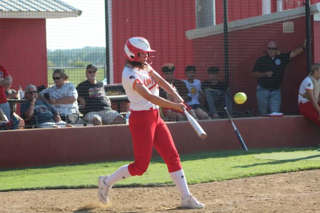 Dale's Jessyn Hartman keeps her eye on the ball during the Aug. 31 game at Dale. The Lady Pirates won 12-0. Countywide &amp; Sun/Natasha Dunagan