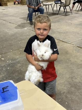 Maddox Magar, 5, of Tecumseh, checks in his rabbit at the Pottawatomie County Free Fair on Sept. 7. Photo provided by Fair Manager Amy Hasbell.