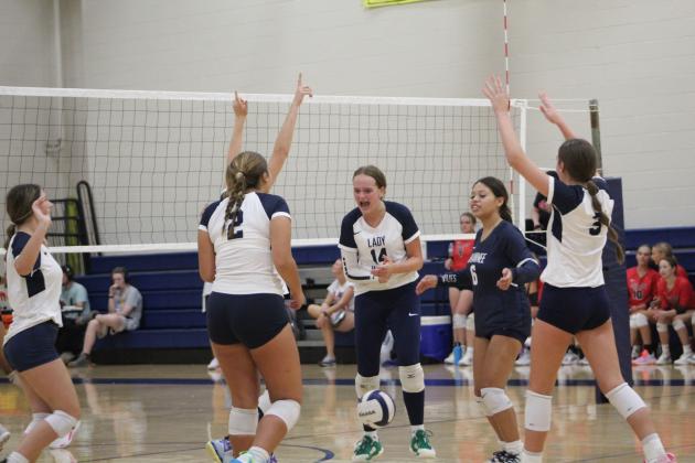 The Shawnee Lady Wolves celebrate a point in their third game against Duncan on Aug. 24. The varsity volleyball team is playing at the Shawnee Middle School gym this year due to tornado damage at the Performing Arts and Athletic Center. They lost, 0-3. Countywide &amp; Sun/Natasha Dunagan