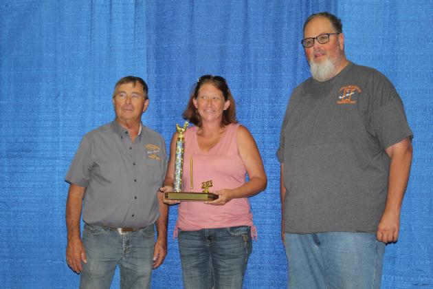 Patricia Lincoln accepts the Kay Jenks Memorial Superintendent's Award in Poultry and Pigeons from Pottawatomie County Free Fair Board Members Lynn Marlow and Tim Underwood on Sept. 9. Countywide &amp; Sun/Natasha Dunagan