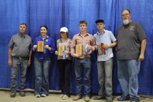 The Tecumseh High School FFA Livestock Judging Team won first place at the Pottawatomie County Free Fair on Sept. 9. Shown, from left, are Fair Board Member Lynn Marlow, Jessica Rushing, Kimberly Holland, Taylor Marrs, Lane Steward and Fair Board Member Tim Underwood. Countywide &amp; Sun/Natasha Dunagan