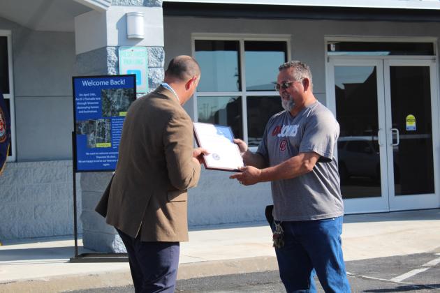 OKC VA Health Care Systems Director Wade Vlosich presents a plaque of recognition to Vernon Penick, who is with Community Facility Services (CFS), the lessor of the Shawnee VA Clinic building on Sept. 18. Countywide &amp; Sun/Natasha Dunagan