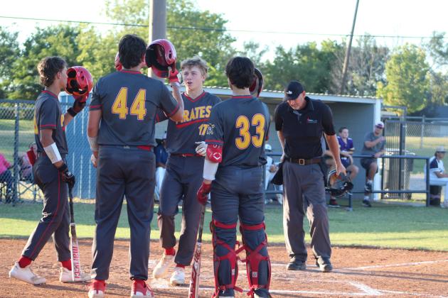 Dale senior Dayton Forsythe hits helmets with his teammates after hitting a home run in the fourth inning of the Sept. 25 game at Asher. The Pirates won, 15-9, and have since won the Class A Regional Tournament, beating Byng twice and losing once to Rattan. They went on to play in the Class A State Quarterfinals on Oct. 5 at Edmond Memorial Field and lost to Silo, 3-4. The Dale Pirates end their season with a record of 20-10. Countywide &amp; Sun/Natasha Dunagan