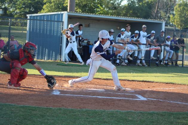 Asher junior Kelby Fowler hits a double in the third inning of the Sept. 25 home game, as Dale senior Ethan Douglas watches. The Indians lost to Dale, 9-15, but they won their Class B Regional Tournament on Sept. 28-29, beating Hammon twice and losing once to Calumet. Asher advanced to the State Quarterfinals on Oct. 5 at Edmond Santa Fe High School and lost to Ft. Cobb-Broxton, 2-12. The Asher Indians end their season with a record of 16-14. Countywide &amp; Sun/Natasha Dunagan