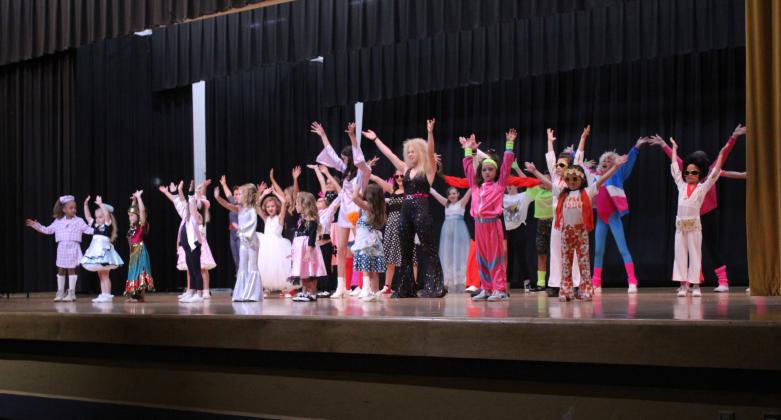 Twenty-seven contestants in the Tot, Little, Junior and Miss Frontier Days Pageant perform the musical number dressed in period costumes for the “Remember When” theme. The pageant was held on Sept. 24 at the W.P. Wood Alumni Center at Tecumseh High School, but the Junior and Miss contestants will be crowned before the Frontier Days Parade on Sept. 30. Countywide &amp; Sun/Natasha Dunagan