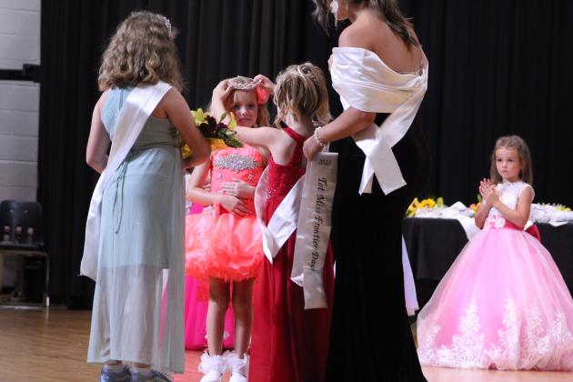 Kenidy Shelby, age 6, is crowned 2023 Tot Miss Frontier Days by last year’s winner Mae McCullough during the Frontier Days Pageant on Sept. 24. There were nine contestants in the Tot division, ages 4-6. Also shown, from left, are 2022 Junior Miss Frontier Days Callie Jane Hart, 2022 Miss Frontier Days Sadie Boatman, and Tot contestant Macklyn Smith, 5.