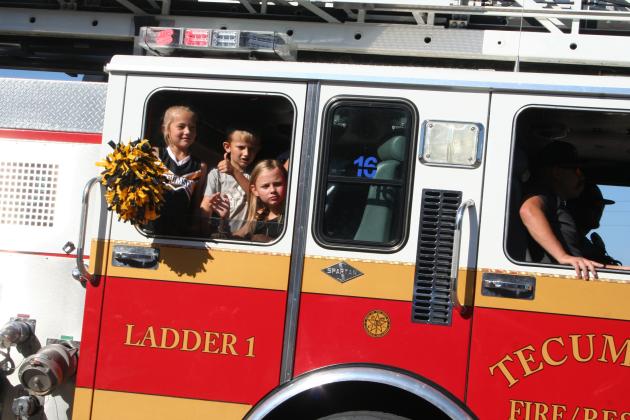 Children ride in a Tecumseh Fire Engine during the Frontier Days Parade on Sept. 30. Countywide &amp; Sun/Natasha Dunagan