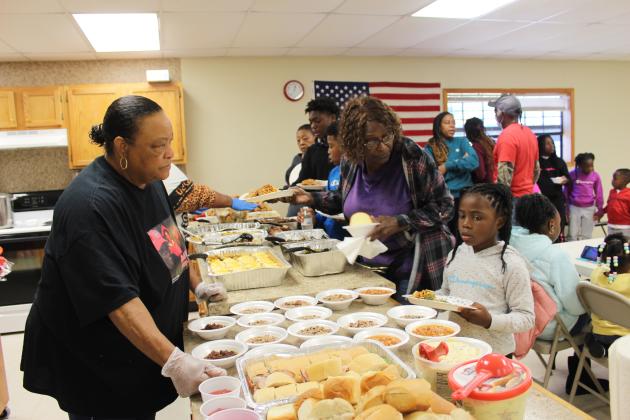 Brooksville 120th Celebration potluck line.