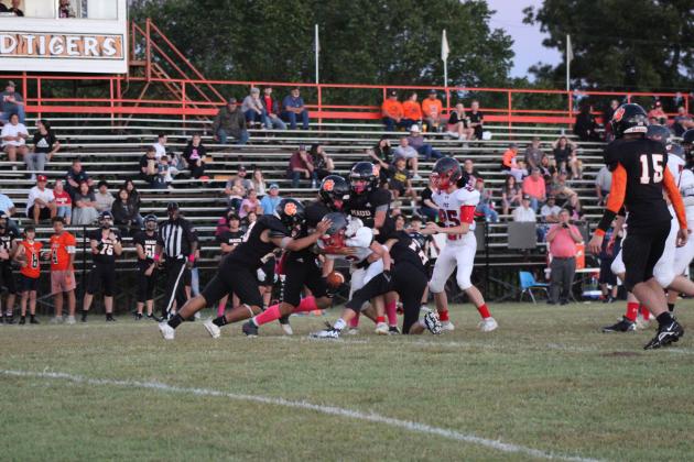 The Maud Tigers defensive players work to bring down a Fox ball carrier at the Homecoming Pink Out game on Oct. 5. Maud won, 50-0. Countywide &amp; Sun/Natasha Dunagan