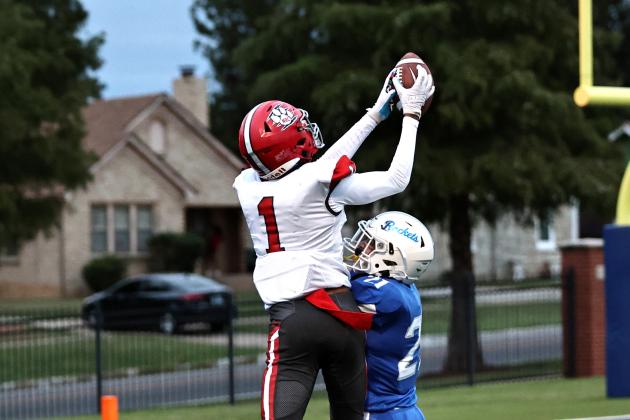 North Rock Creek's Memphis Burdine leaps over a Mount St. Mary's defender for a touchdown catch. NRC beat Mount St. Mary, 46-20.  NRC will take on Anadarko tonight.