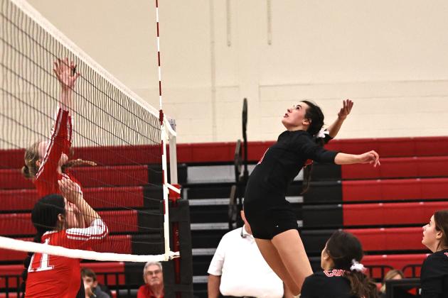 North Rock Creek's Chloe Kasterke goes up for a kill. Photo courtesy of Gowin Photography